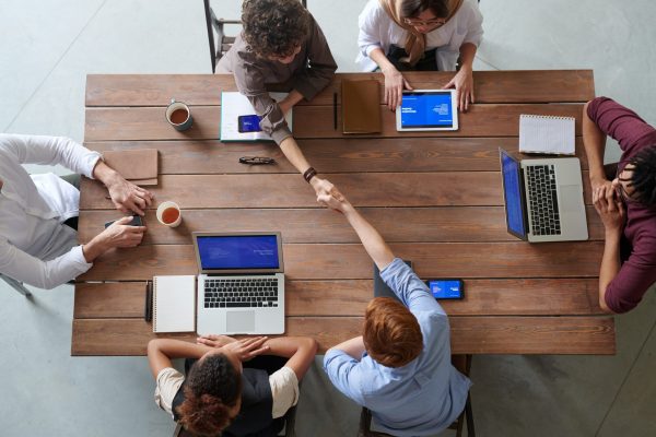 employees gathered around a table